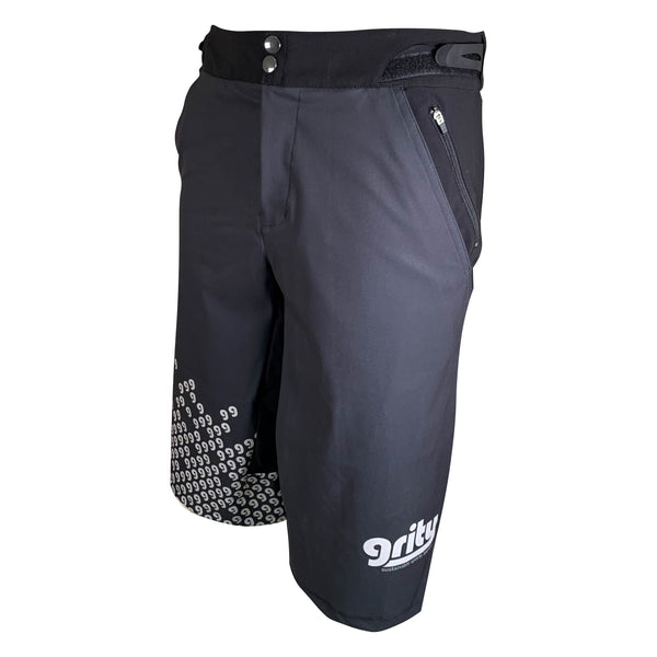 Side view Mountain bike baggy shorts, charcoal grey with a ggg pattern on the right cuff
