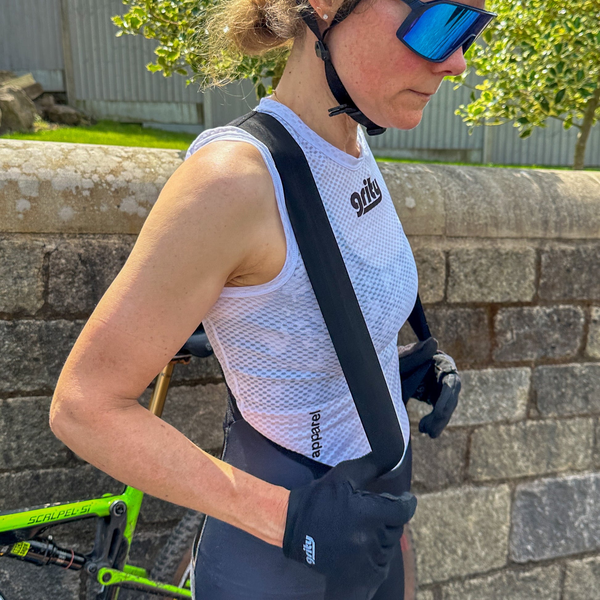 Woman wearing baselayer and sun glasses